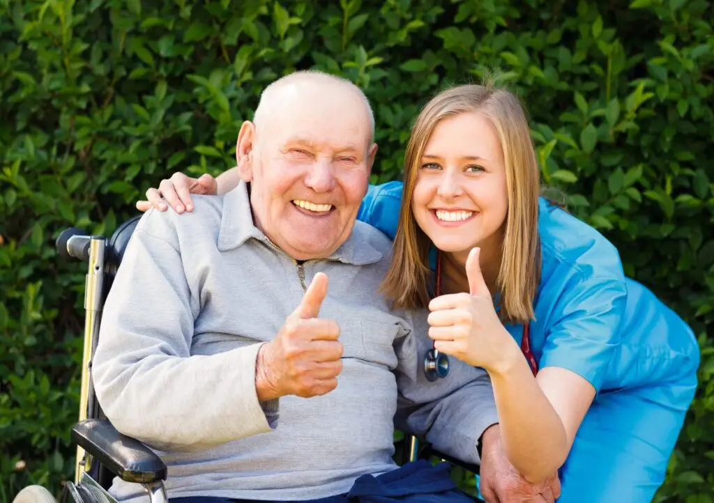 smiling patient with aide